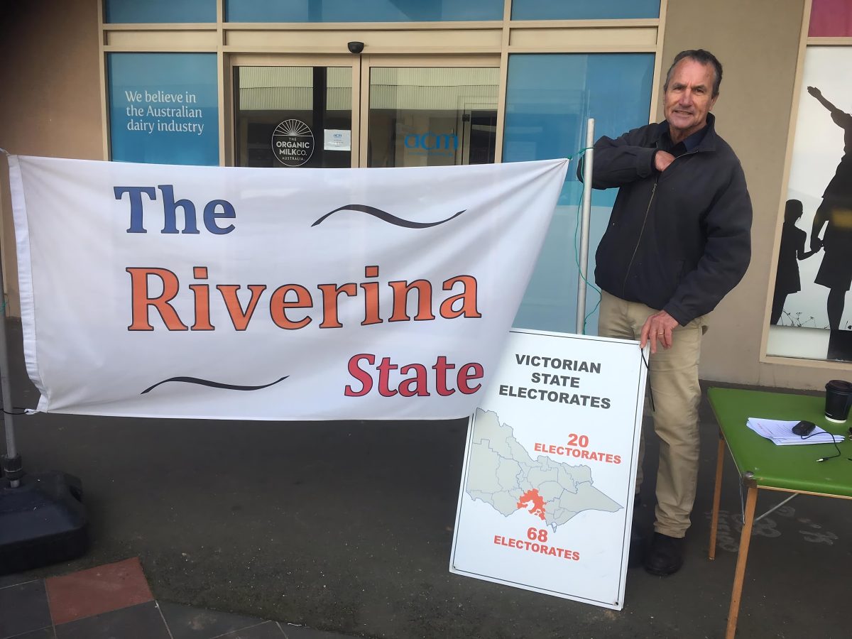 man with a Riverina State flag