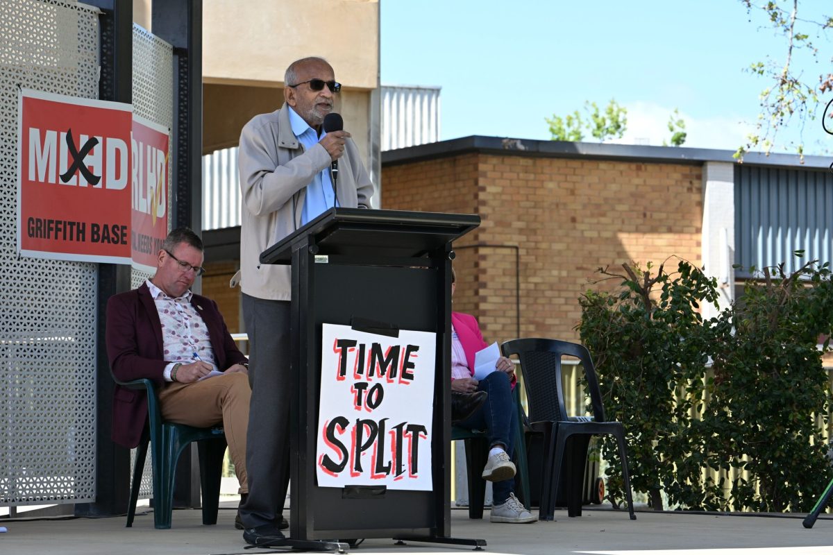 man speaking to crowd