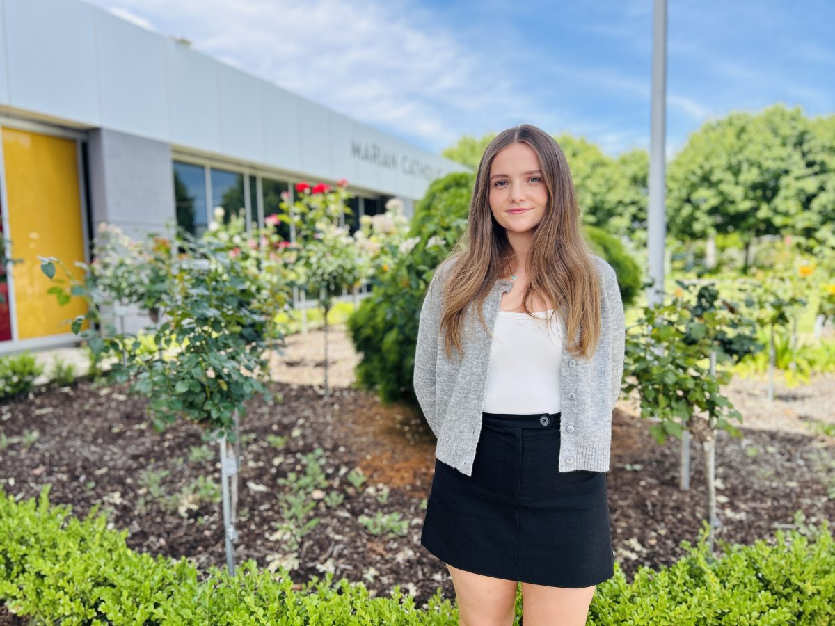 Meg Walsh in front of school 