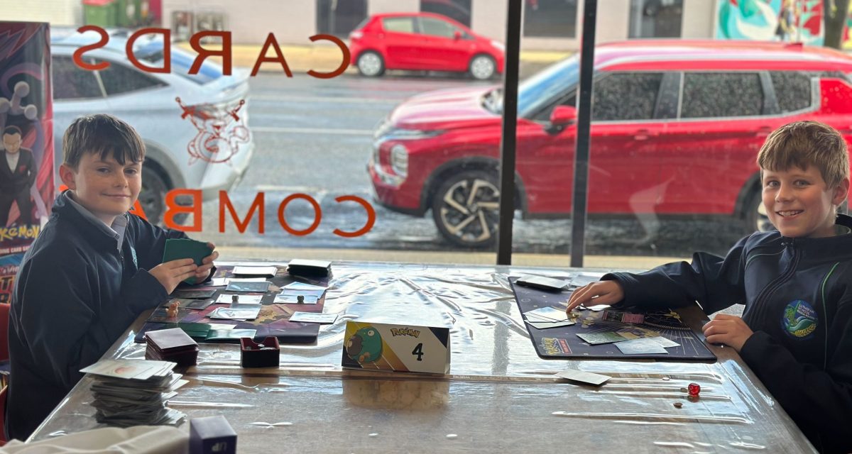 Grayson Kennedy and Charli Kliman love playing Pokemon at Cards and Combat.