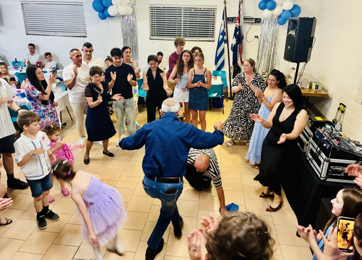 People dancing Greek style at a celebration