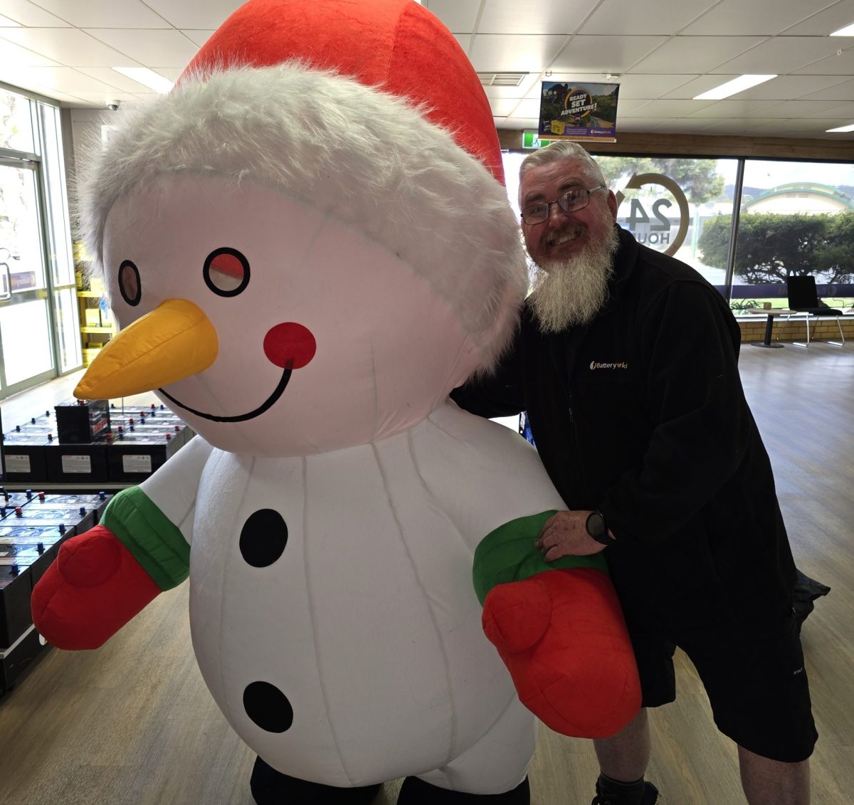man with an inflatable snowman