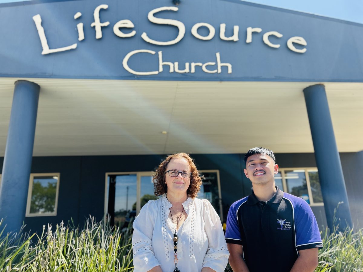 Student and teacher outside school 