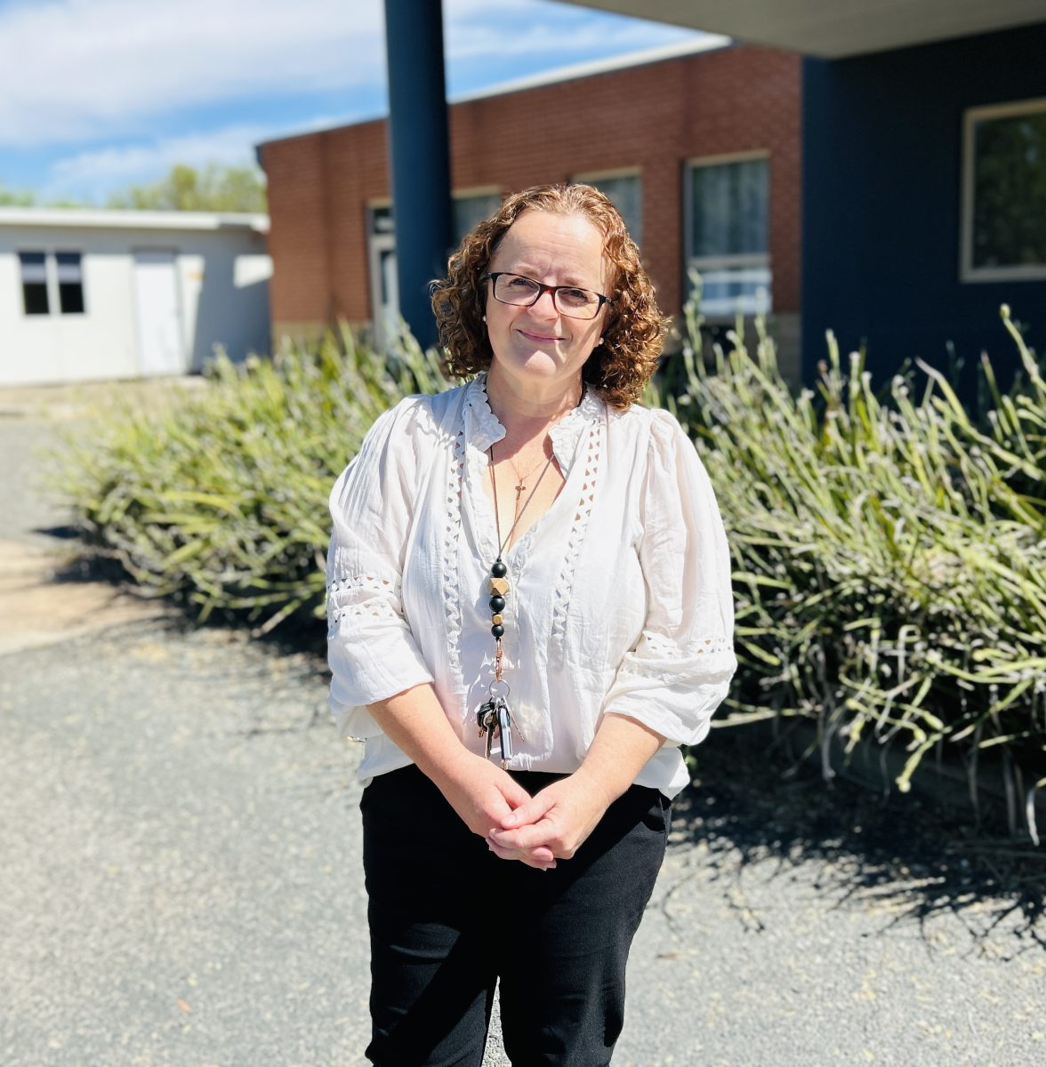 woman in front of school 