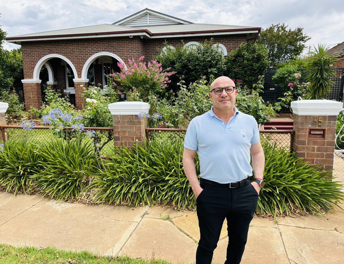 Man standing in front of a house