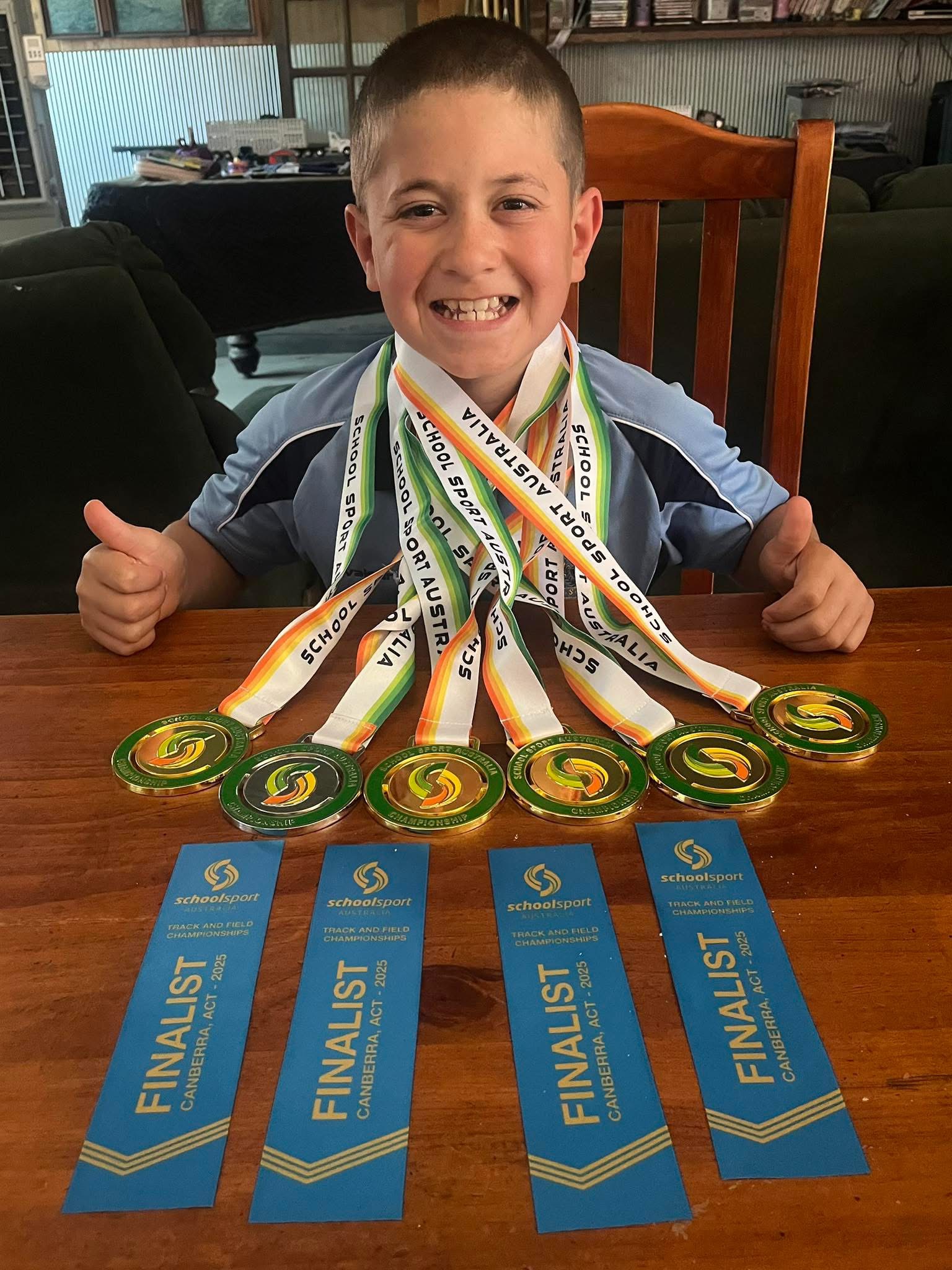 Nangus Primary School champion Cody Wheeler with his five gold and one silver medal and four ribbons from the national School Sport Australia Track and Field Championship held at the AIS in Canberra at the weekend.