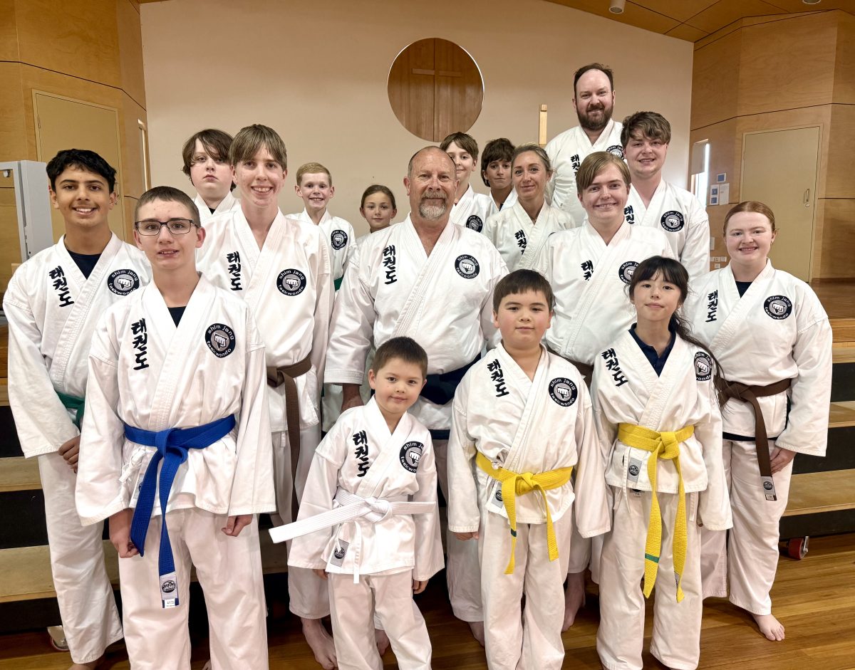 Wagga’s new Assistant Grand Master of Shim Jang Taekwondo Craig Heaketh (centre) with students from his Thursday night class at Wagga’s Mater Dei School hall. Picture: Marguerite McKinnon.