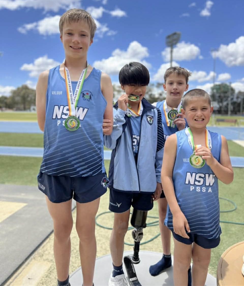 Cody Wheeler with “my mates” Samuel, Hudson and William, holding up their silver medals for the 4 x 100 metre multi class relay.