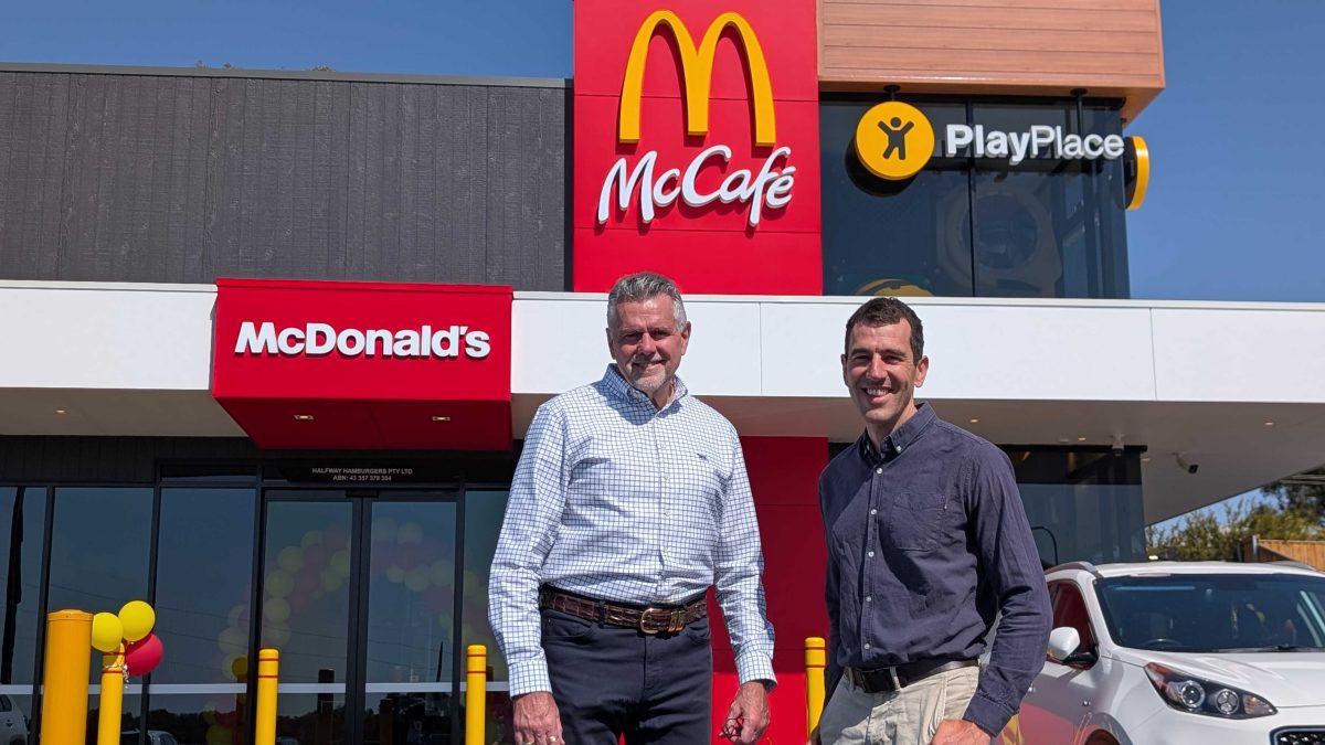 Griffith farmer Ben Parle (right) provides the pickles to more than 1000 McDonald's restaurants across the country, including the new store at Boorooma owned and run by Tony Aichinger (left)