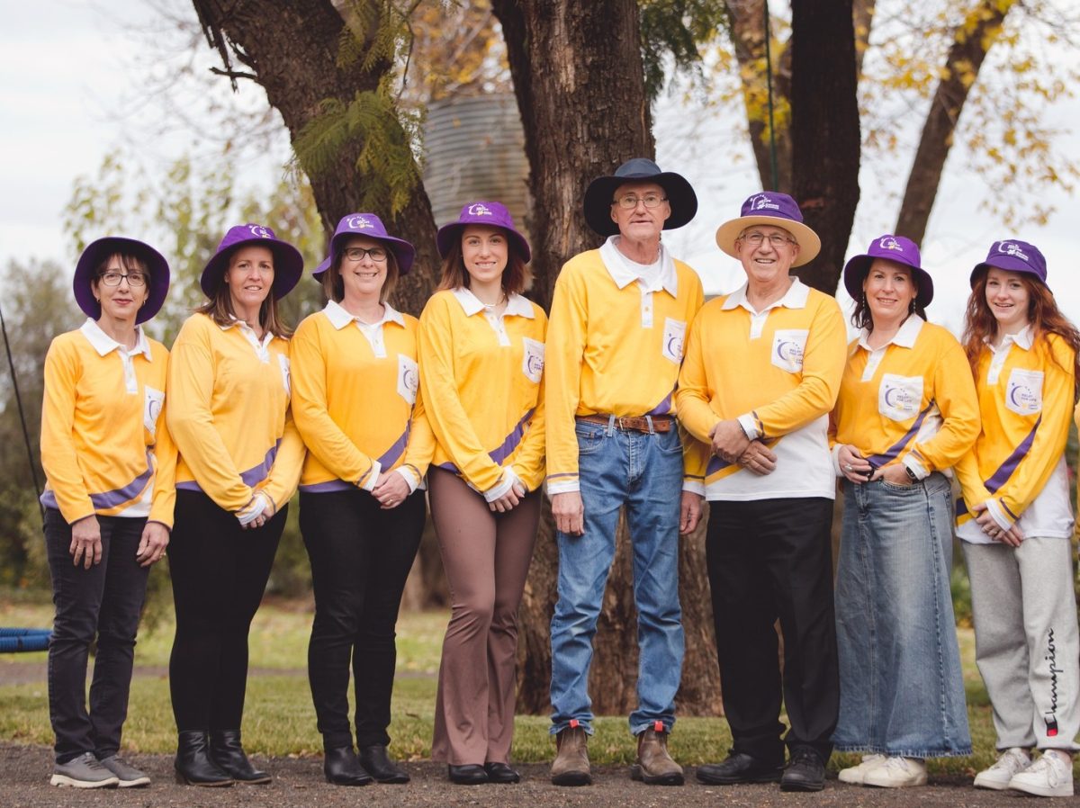 row of people in yellow shirts