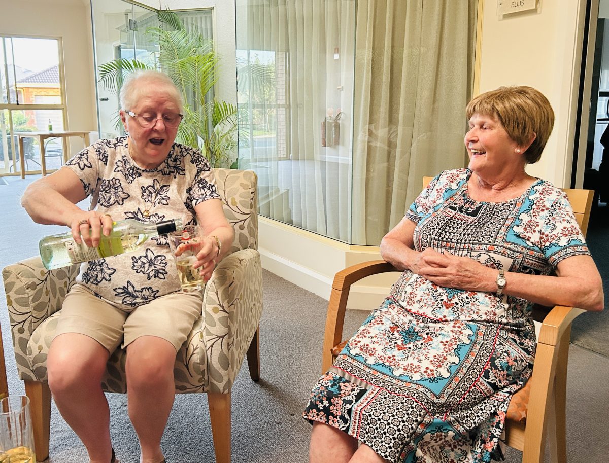 two women drinking wine 