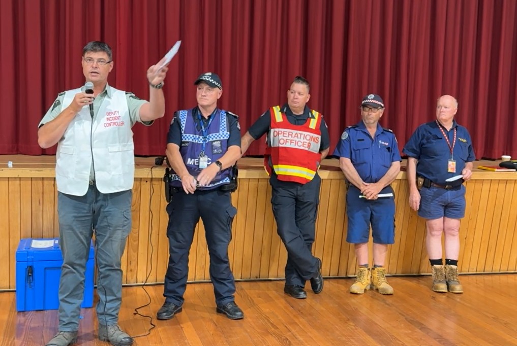 Deputy incident controller Dave Jensen addresses a community briefing on Wednesday