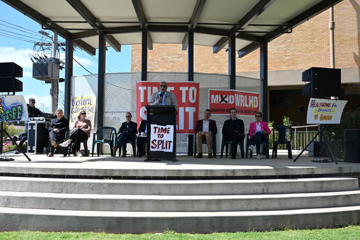 man speaking at rally