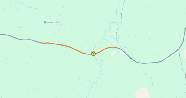 Man dies after car slides down embankment, highway closed